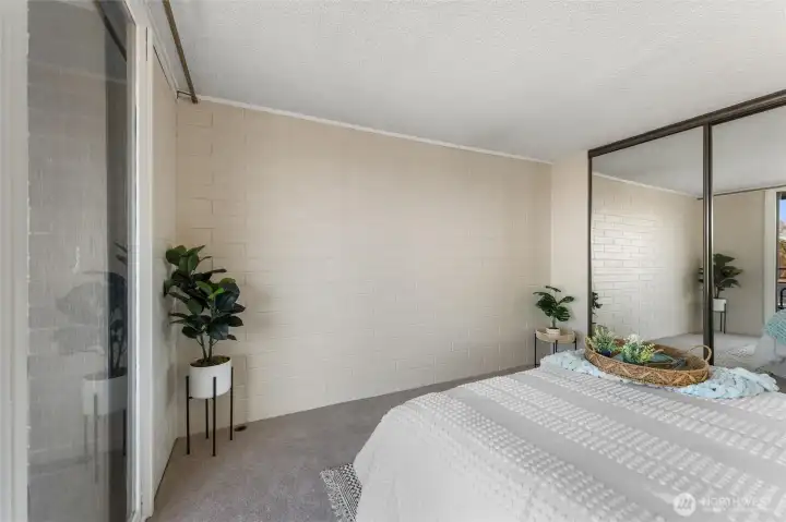 Bedroom view showcasing peaceful waterfront scenery and natural light.