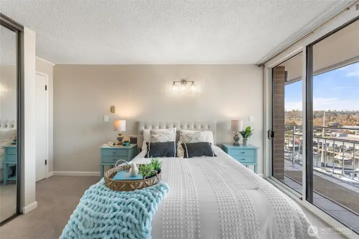 Primary bedroom perspective with marina views creating a calming retreat.