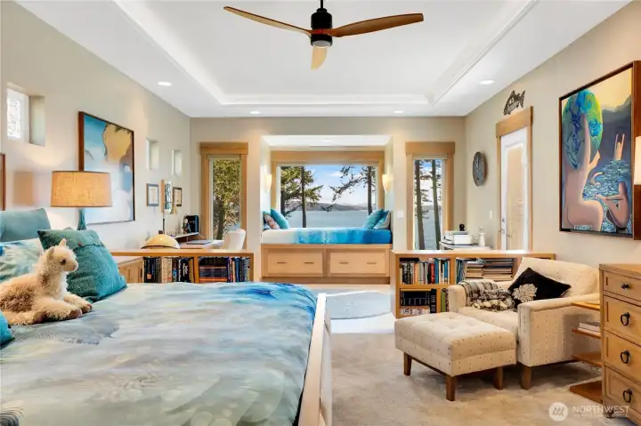 The primary suite is positioned to capture views of Jones Island, Orcas Island, and Mt. Baker, with ample natural light throughout. The layout includes two walk-in closets and a practical circulation pattern that supports everyday use.