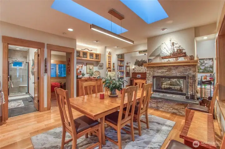 A double-sided fireplace separates the living areas while maintaining flow and visibility.