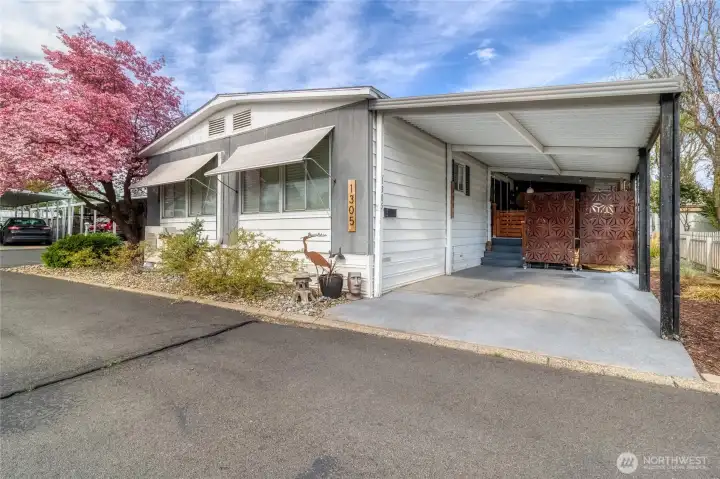 Carport with private deck behind it