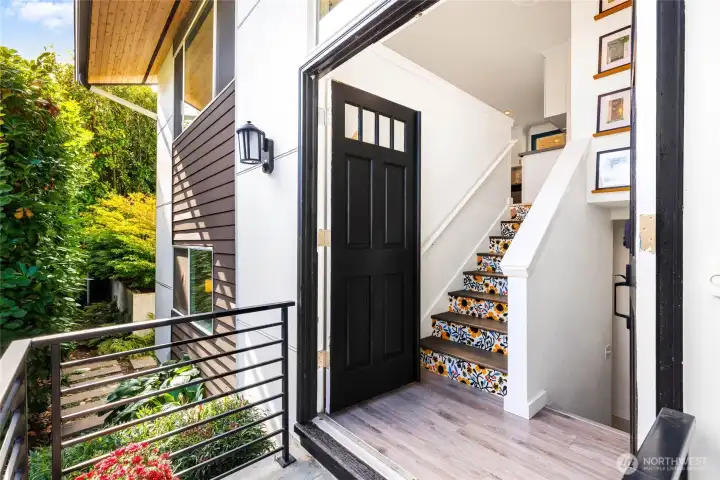 Robust metal railings and double entry doors welcome you in