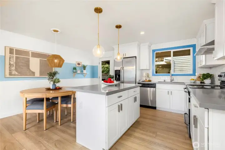 Designer kitchen with quartz counters and matching stainless appliances