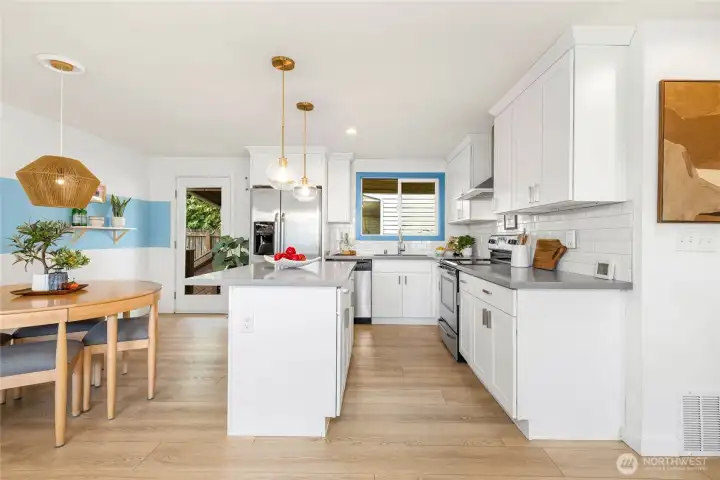 Designer kitchen with quartz counters and matching stainless appliances