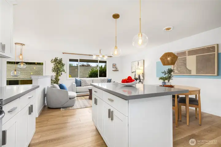 Designer kitchen with quartz counters and matching stainless appliances
