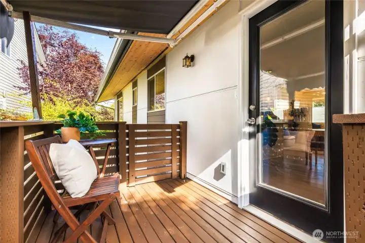 Covered back porch off kitchen, with access to back yard