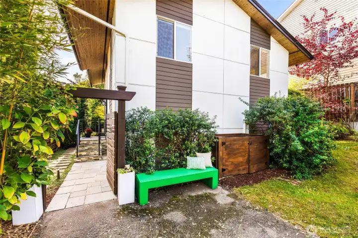 Welcoming entrance with elegant recycling bin receptacles