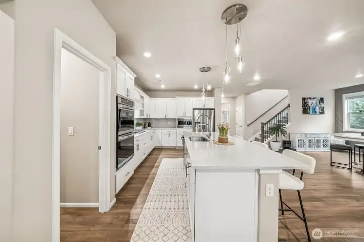 Another view of kitchen with pantry on left