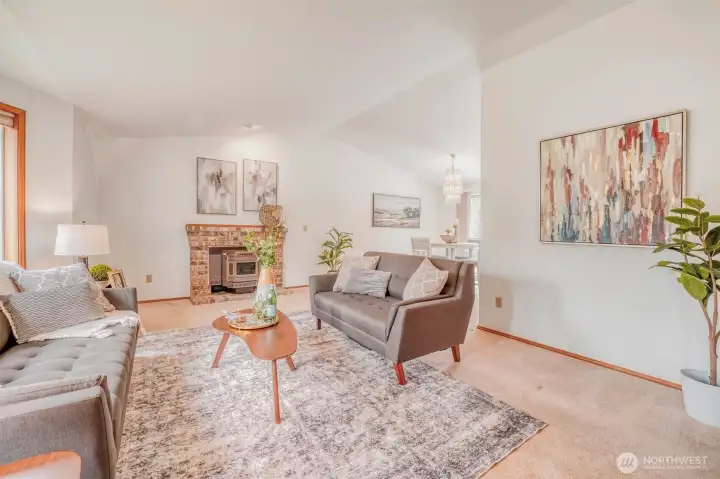 Brick-surround fireplace adds warmth and architectural character.