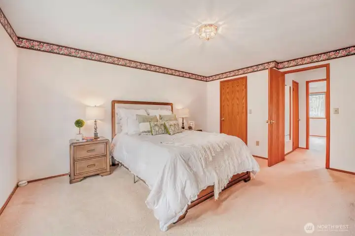 Primary bedroom offers comfort and privacy.