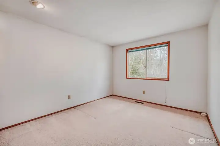 Secondary bedrooms offer versatility for guests or home office use.