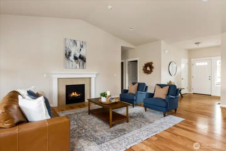 Cozy gas fireplace + engineered hardwood flooring