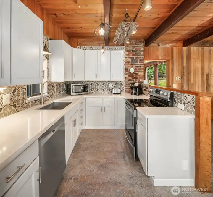 Take in another perspective of the bright, open kitchen where charm and functionality come together beautifully.