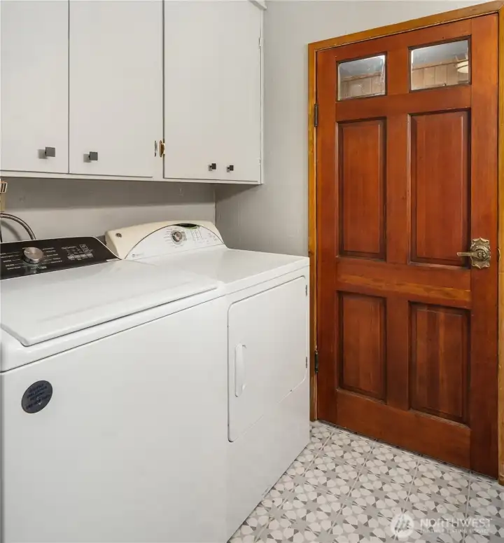 Laundry combined with the half bathroom in the main house.