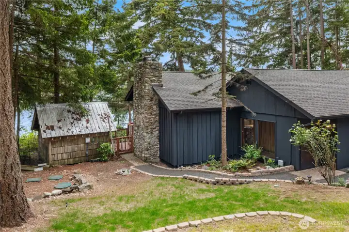 Front yard enhanced by thoughtfully designed walkways and inviting landscaping.