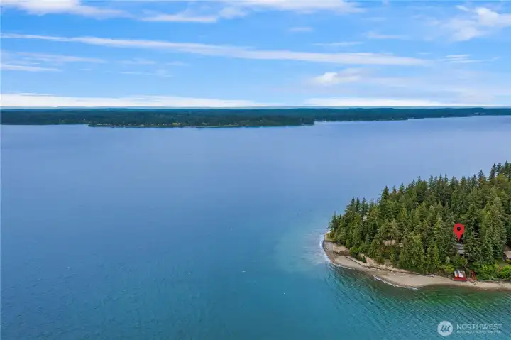 Take in another beautiful view of the home from the water, showcasing its serene waterfront setting.