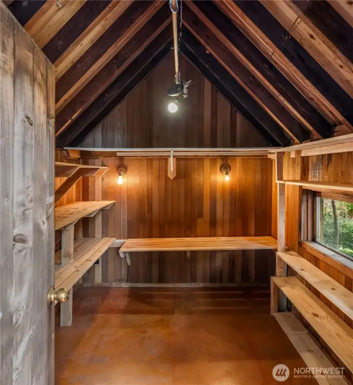Versatile heated outbuilding adjacent to the main house, perfect for a workshop, studio, or additional storage.