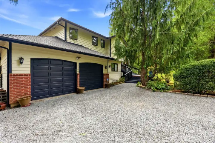 Attached two car garage and pathway to the front entry. Attached two car garage and pathway to the front entry.