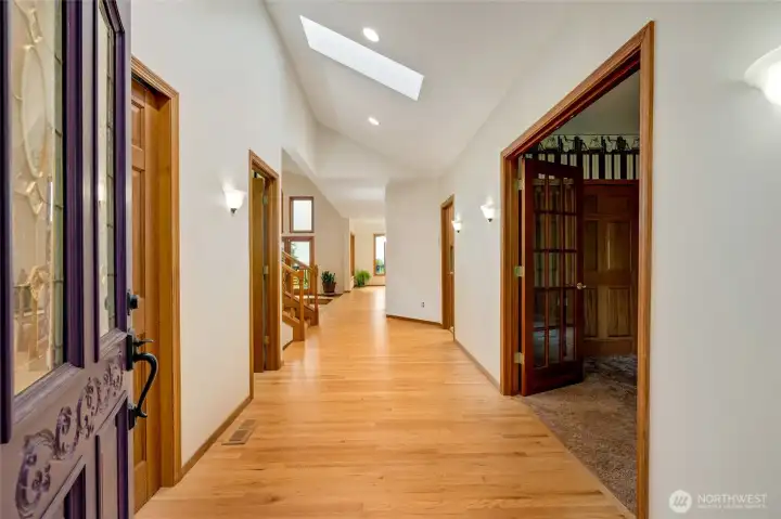 Entry way flooded with light with a half bath on the left and study complete with double French doors on the right. Entry way flooded with light with a half bath on the left and study complete with double French doors on the right.