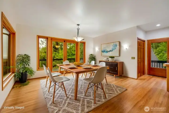 Beautiful hardwood floors continue from the entry into the dining area with yet another set of French doors leading to the huge deck. Enjoy mornings and evening dinners taking in the phenomenal view of the sound and Everett skyline. Beautiful hardwood floors continue from the entry into the dining area with yet another set of French doors leading to the huge deck. Enjoy mornings and evening dinners taking in the phenomenal view of the sound and Everett skyline.
