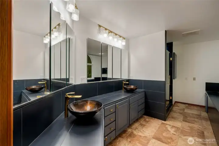 Large double vanity in primary bathroom with walk in shower. Large double vanity in primary bathroom with walk in shower.