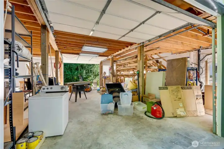 First level of the shop is 1200 sqft complete with bay doors on both sides to allow for pull through access to the back. First level of the shop is 1200 sqft complete with bay doors on both sides to allow for pull through access to the back.