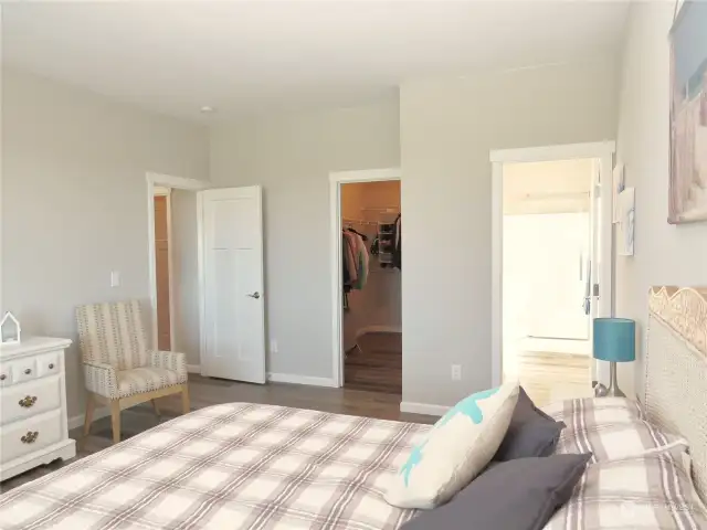 THE ROOM IS COZY WITH ATTACHED PRIMARY BATH AND WALK-IN CLOSET!