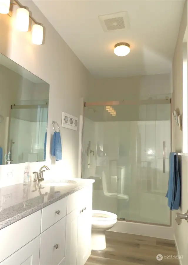 PRIMSRY BATH HAS DOUBLE SINKS AND QUARTZ COUNTERS WITH GLASSED IN LARGE SHOWER WITH SEATING!