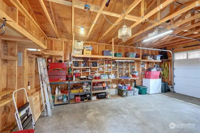 Single car garage with storage shelving and some countertop space was built in 2019.