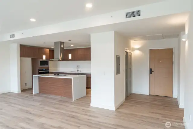 Entry door and kitchen.