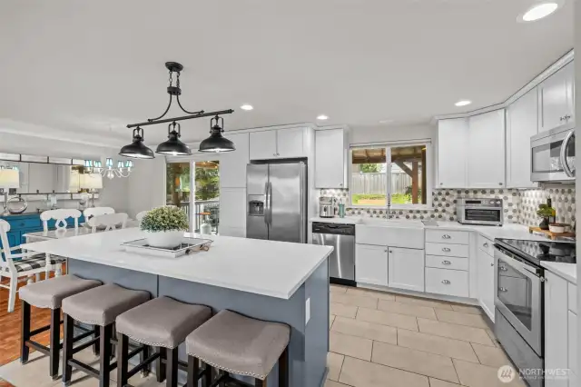 This kitchen brings a smile to your face! A fantastic space with back yard views.