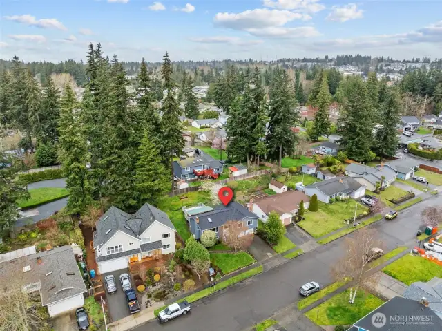 On location birds eye view with community surroundings. This location offers convenience and connectivity.