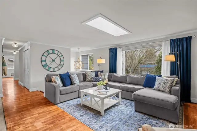 Living room with hardwood floors, and territorial front yard views.