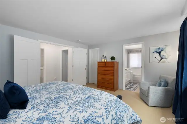 Double-door entry and large walk-in closet are featured in the primary ensuite bedroom