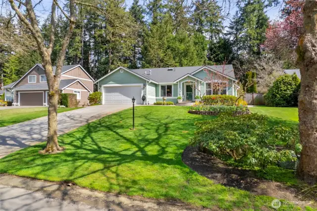 The sycamore-lined street lends charm and character in this desirable Gig Harbor neighborhood