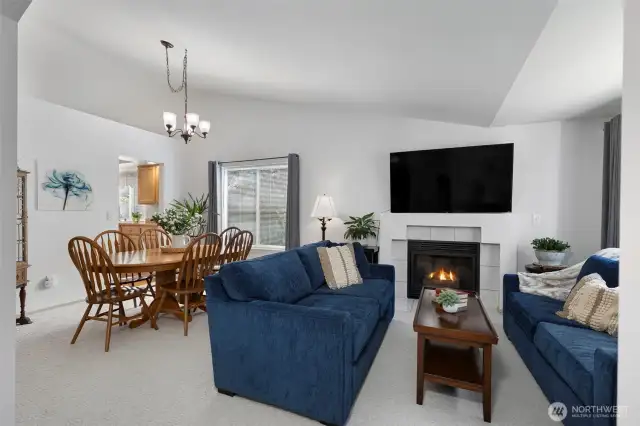 Living and dining room with cozy gas fireplace