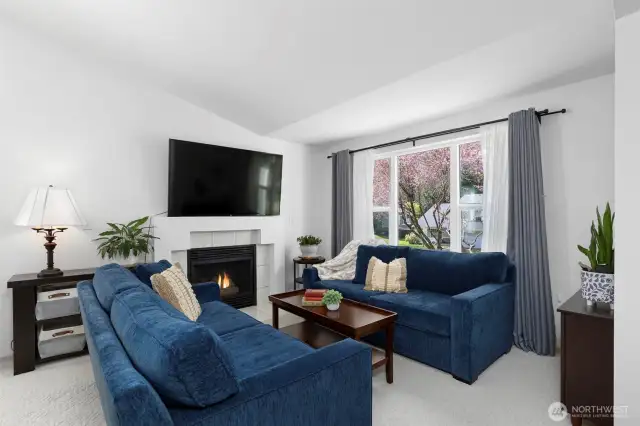 Gaze through the picture window to embrace the lovely landscaping