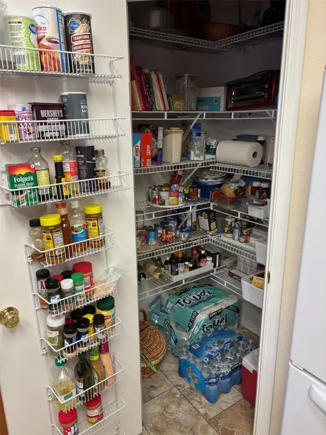 Walk-in pantry with so much storage room.