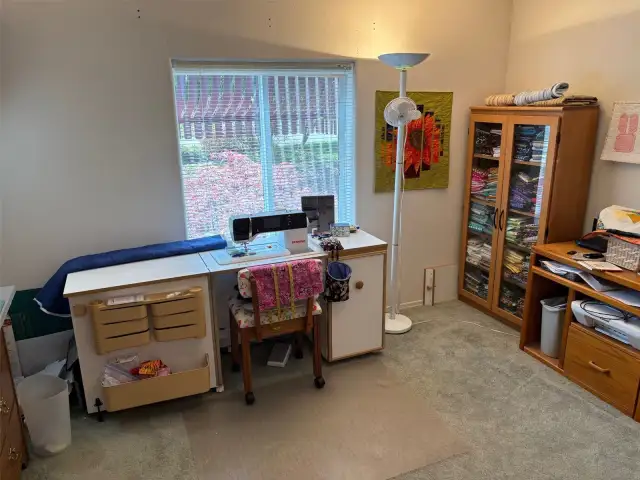 Guest bedroom which is used now as a sewing room.