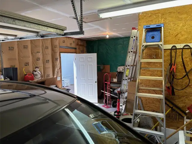 Huge 2 car garage with a shop space.