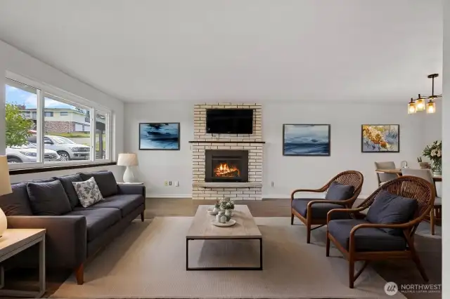 Virtually staged living room. New gas frplc insert.
