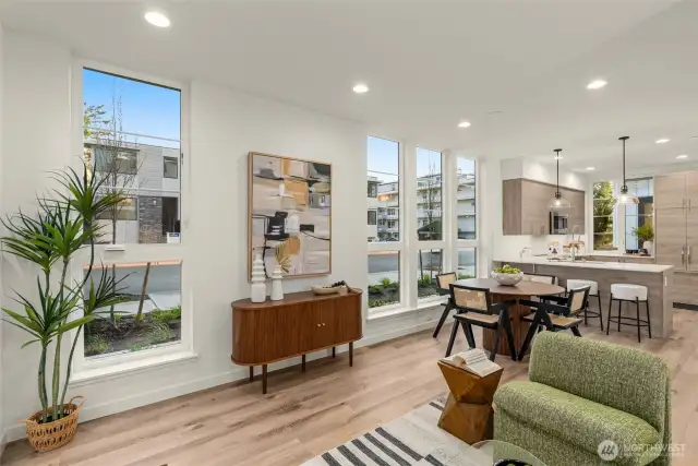 Floor-to-ceiling windows let the light pour in and bring the outside world into your daily rhythm. Just imagine morning coffee or golden hour glow filling this entire space.