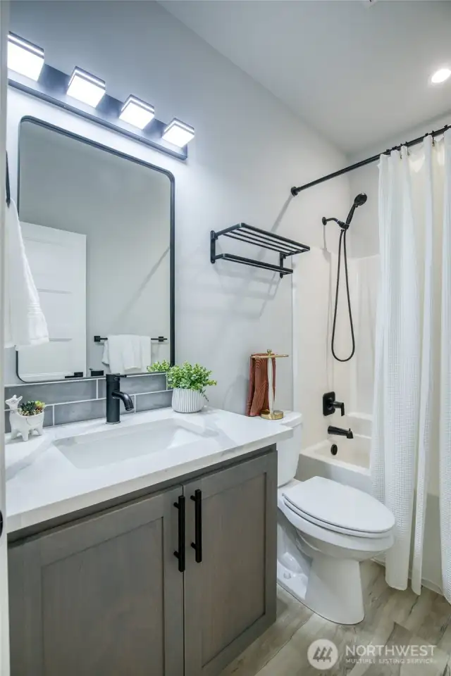 Main full bath with black fixtures