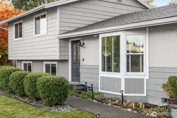 COME ON IN | You'll appreciate the concrete sidewalks that lead to the street and graciously border the property.