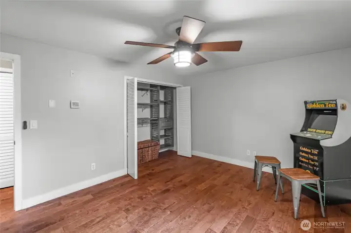 UPPER LEVEL | Another view of the primary bedroom. You'll appreciate the closet system and functional ceiling fan.