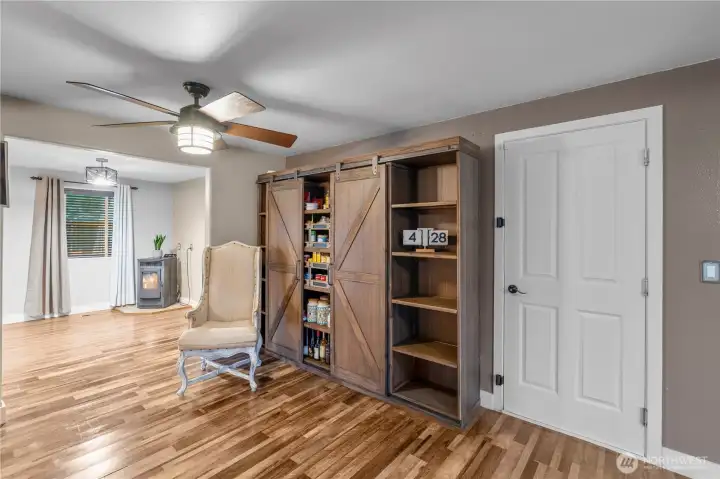 MAIN FLOOR PANTRY AREA | Yes, the beautiful and functional cabinet stays with the home.