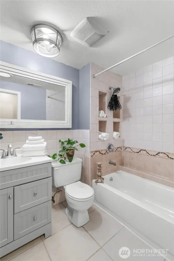 UPPER LEVEL | The guest bathroom features a tub/shower combo.
