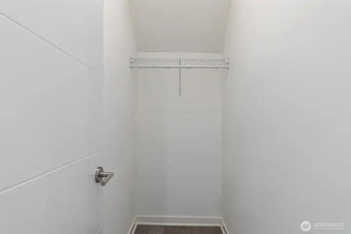 Walk-in closet in the third floor primary suite.