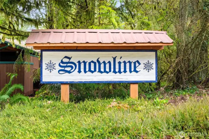 Snowline community entrance—gateway to year-round recreation.