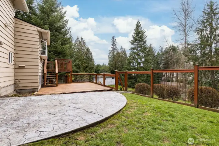 Patio/deck area is fully-fenced